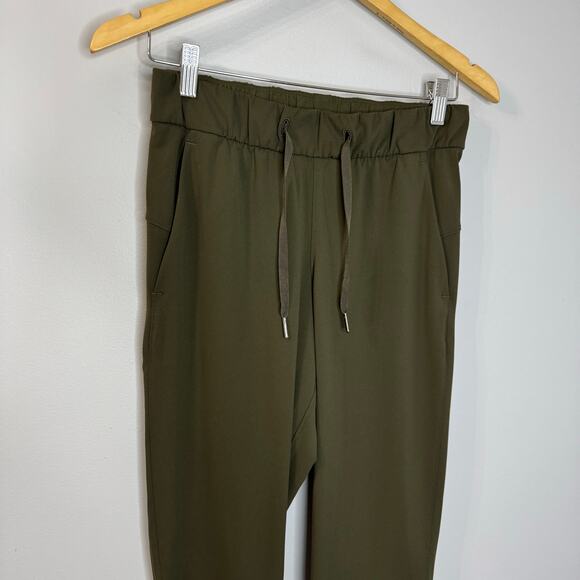 Lululemon On the Fly 7/8 Pant Drawstring Woven Dark Olive Women's 4 - Picture 11 of 11